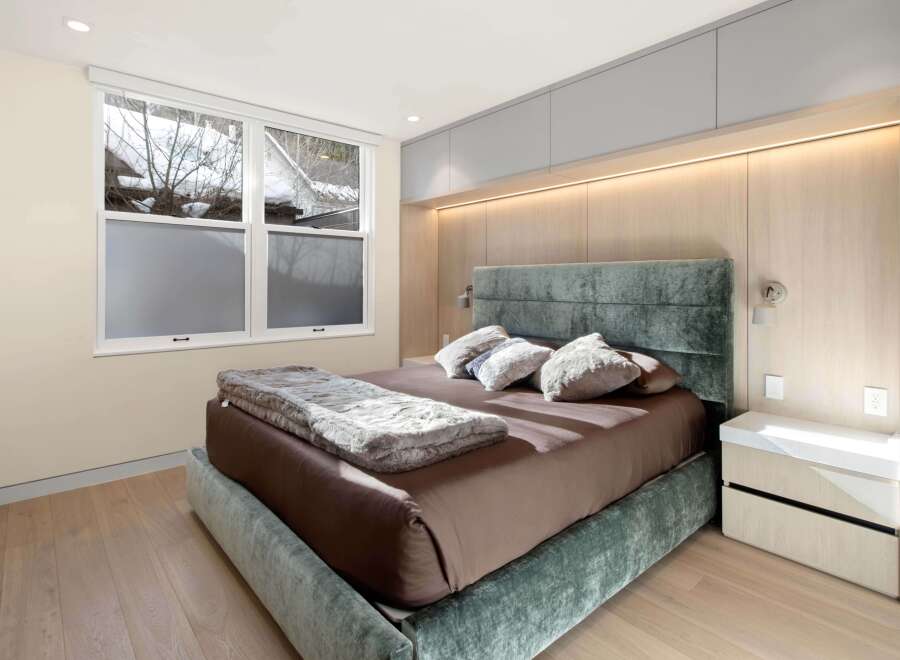 Luxurious bedroom with a stunning view and custom built-ins.