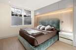 Luxurious bedroom with a stunning view and custom built-ins.