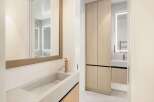 This stunning bathroom boasts a sleek, modern design with a floating concrete sink and a minimalist faucet.
