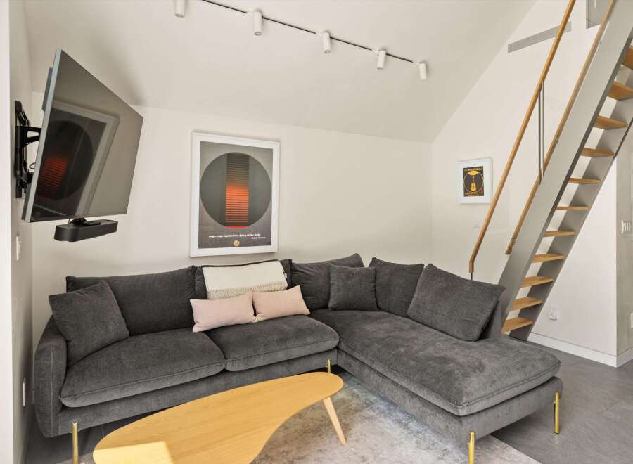 Modern living room with a comfortable sectional sofa and stylish decor.