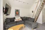 Modern living room with a comfortable sectional sofa and stylish decor.