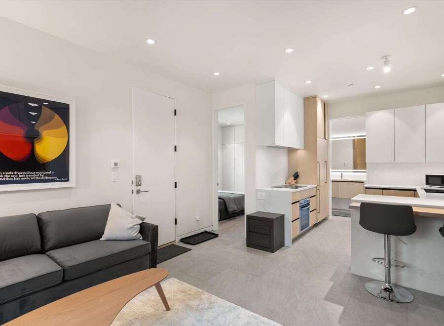 Modern apartment with open-concept living and kitchen.