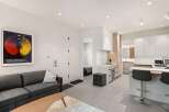 Modern apartment with open-concept living and kitchen.