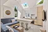This stunning property boasts a bright, open-concept kitchen with modern appliances and ample counter space.
