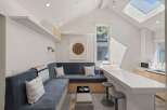 This stunning property boasts a bright, open-concept design with a built-in banquette seating area perfect for relaxing.