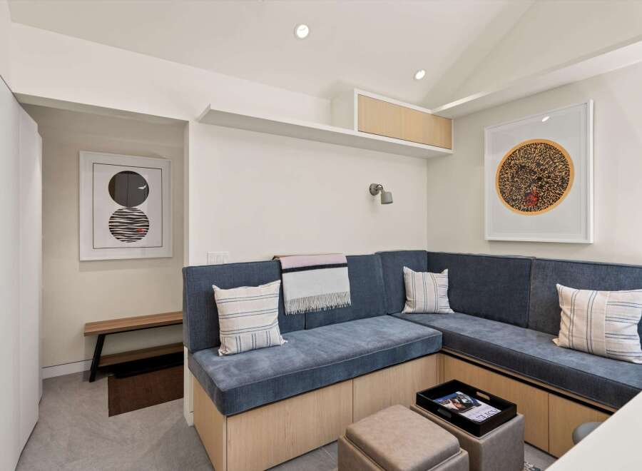 This stunning property boasts a built-in banquette seating area, perfect for relaxing and enjoying company.