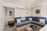 This stunning property boasts a built-in banquette seating area, perfect for relaxing and enjoying company.