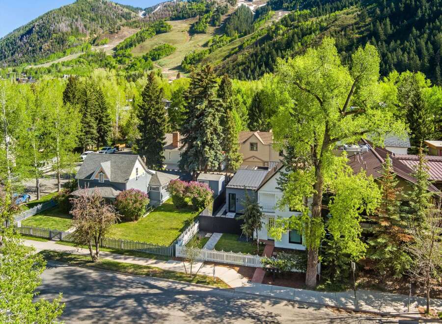 This charming home boasts a picturesque setting nestled in the mountains, offering breathtaking views.