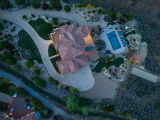 This stunning property boasts a large, inviting pool and expansive patio perfect for outdoor entertaining.