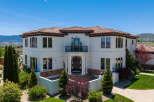 This stunning Mediterranean-style home boasts a desirable location with breathtaking mountain views.