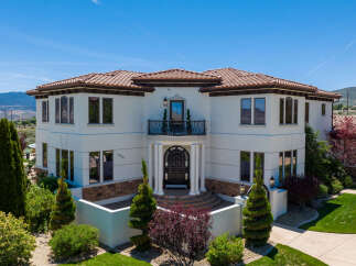 This stunning Mediterranean-style home boasts a desirable location with breathtaking mountain views.