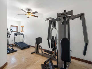 This home boasts a fully equipped gym, perfect for your fitness routine.