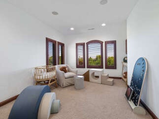 This stunning nursery boasts a neutral color palette, complemented by natural textures and modern furniture.