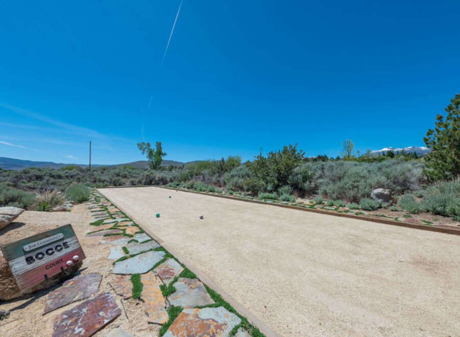 Enjoy outdoor games on this stunning bocce ball court, complete with a picturesque landscape and mountain views.