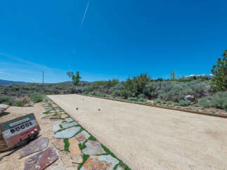 Enjoy outdoor games on this stunning bocce ball court, complete with a picturesque landscape and mountain views.