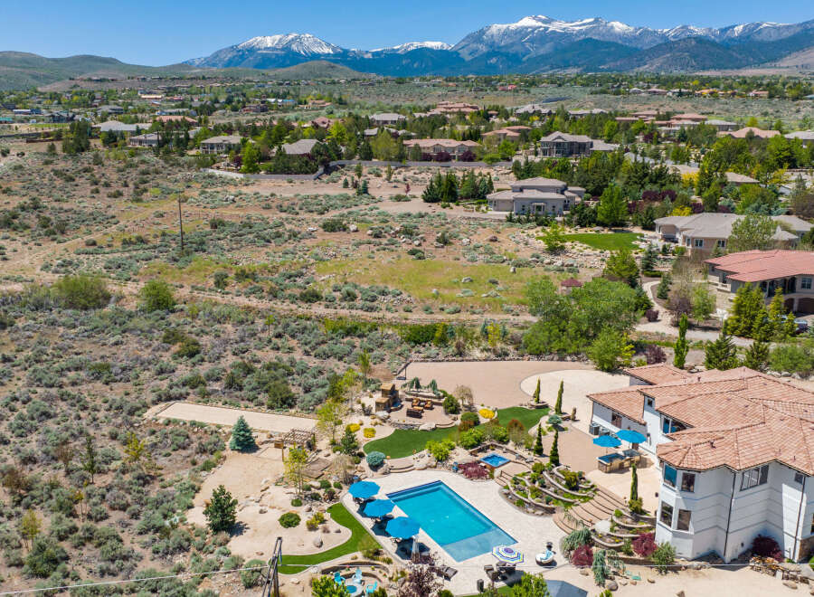 Luxury estate boasting a stunning pool and expansive backyard, perfect for entertaining.