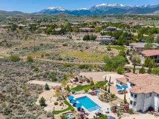 Luxury estate boasting a stunning pool and expansive backyard, perfect for entertaining.