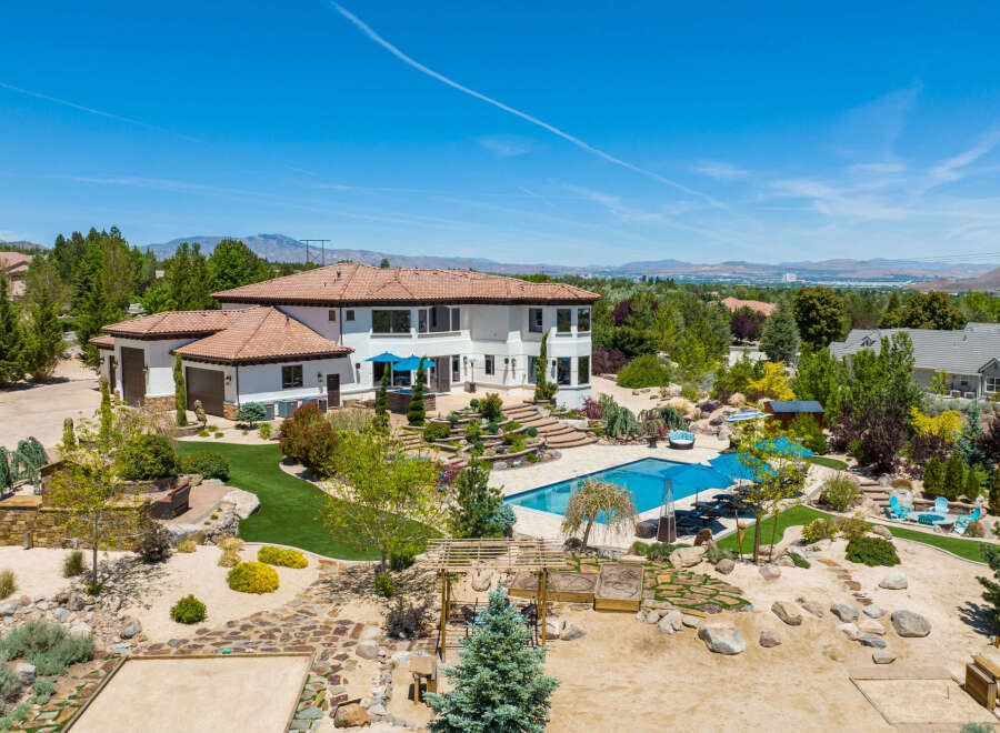 This stunning property boasts a luxurious Mediterranean-style home with a spacious backyard oasis.