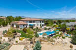This stunning property boasts a luxurious Mediterranean-style home with a spacious backyard oasis.