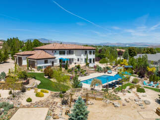 This stunning property boasts a luxurious Mediterranean-style home with a spacious backyard oasis.
