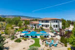 This stunning property boasts a luxurious outdoor oasis, complete with a sparkling pool, spacious patio, and fire pit.