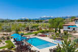 Luxury estate boasting a stunning pool and spa, nestled in a picturesque mountain setting.
