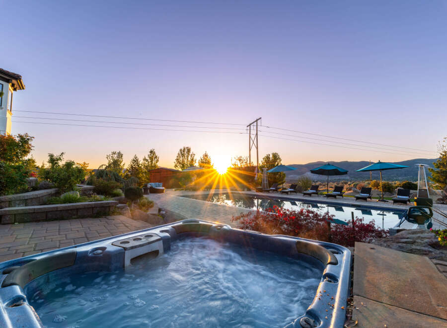 Luxury estate with breathtaking sunrise views, featuring a private pool and hot tub.