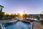 Luxury estate with breathtaking sunrise views, featuring a private pool and hot tub.
