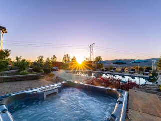 Luxury estate with breathtaking sunrise views, featuring a private pool and hot tub.