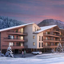 Luxury apartments nestled in a stunning snowy mountain setting.