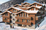 Luxury chalet apartments in the French Alps, offering stunning mountain views and ski-in/ski-out access.