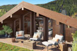 Mountaintop luxury awaits in this stunning chalet boasting a spacious rooftop deck.