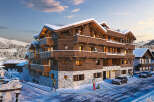 Luxury chalet apartments in the French Alps, offering stunning mountain views and ski-in/ski-out access.
