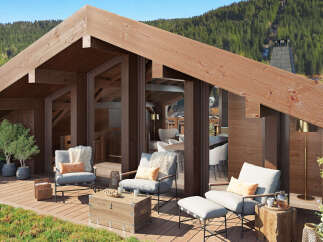 Mountaintop luxury awaits in this stunning chalet boasting a spacious rooftop deck.