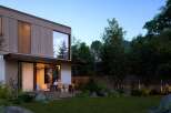Stunning modern home nestled in a lush forest setting.