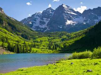 Nestled in the heart of Colorado's majestic mountains, this serene lakefront property offers breathtaking views of snow-capped peaks and lush greenery.