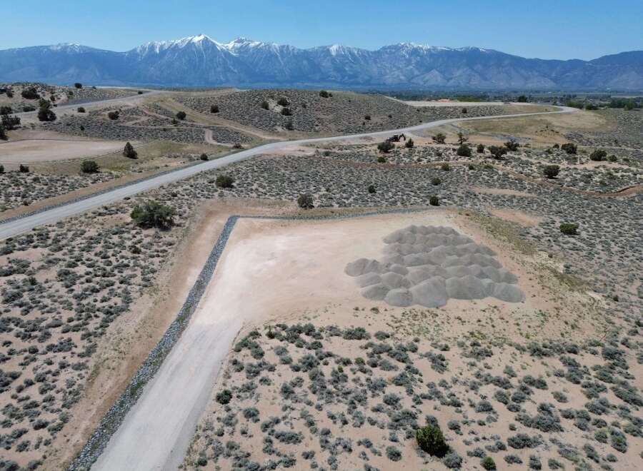 This property boasts stunning mountain views and a spacious, level building site, perfect for your dream home.