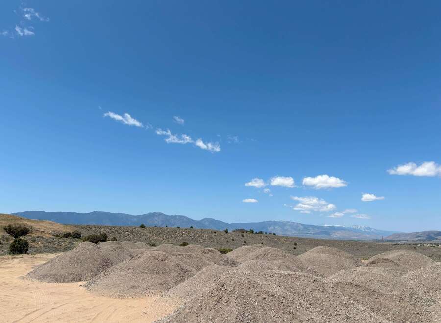 Discover tranquility in this expansive desert landscape, featuring stunning mountain views and ample space for outdoor adventures.