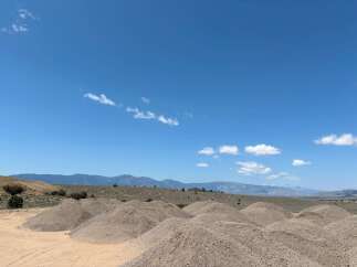 Discover tranquility in this expansive desert landscape, featuring stunning mountain views and ample space for outdoor adventures.