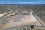 This property boasts a stunning mountain backdrop and expansive desert landscape.