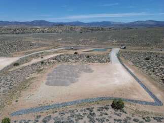 This property boasts a stunning mountain backdrop and expansive desert landscape.