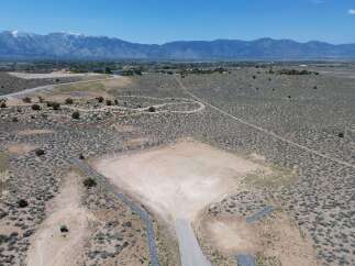 This stunning property boasts breathtaking mountain views and a spacious lot, perfect for building your dream home.