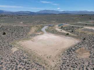 This stunning property boasts a spacious, level lot perfect for building your dream home, offering breathtaking views of the surrounding mountains and desert landscape.