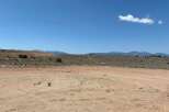 This vacant land boasts stunning mountain views and a spacious, level lot perfect for building your dream home.