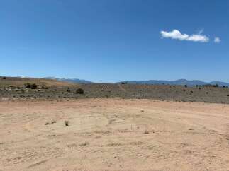 This vacant land boasts stunning mountain views and a spacious, level lot perfect for building your dream home.