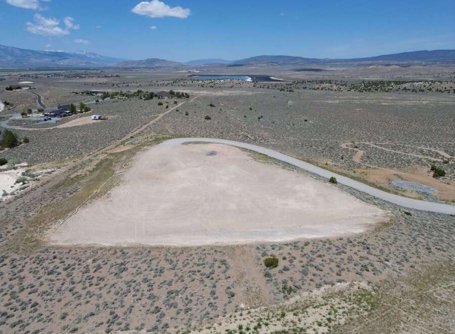 This stunning property boasts a spacious, level building site perfect for your dream home, complete with a paved access road.
