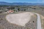 This vacant lot boasts a prime location in a desirable neighborhood, offering breathtaking mountain views and a tranquil setting.