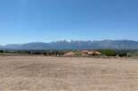 Mountain views and a spacious lot await in this stunning location.