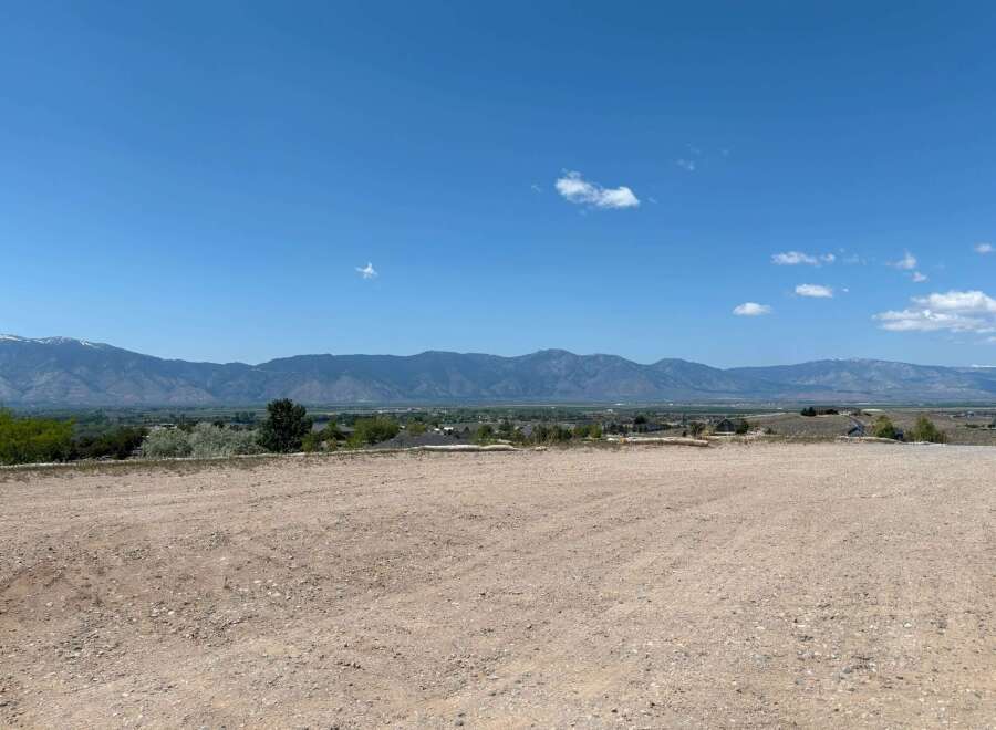 This stunning property boasts breathtaking mountain views and a spacious, level lot, perfect for building your dream home.