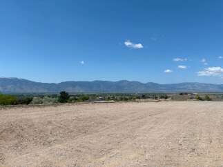 This stunning property boasts breathtaking mountain views and a spacious, level lot, perfect for building your dream home.